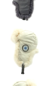 Detailed view of thick winter trapper hats with faux fur lining and windproof ear flaps