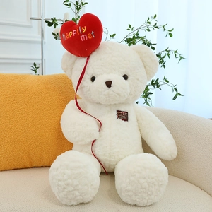 White teddy bear plush with red heart balloon on sofa, cozy home gift decoration