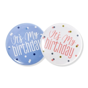 Detail of blue and white 'It's My Birthday' badges with colorful polka dot patterns