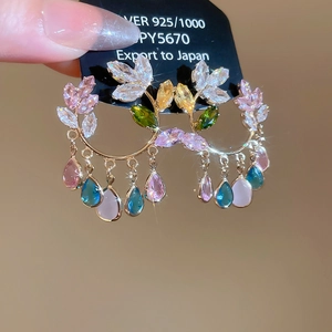 Close-up of 925 silver butterfly earrings with colorful zircon and water drop pendants