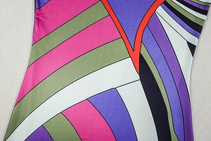 Close-up of vibrant striped geometric print fabric on long sleeve bodycon dress
