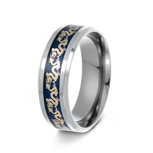 Macro detail of vintage dragon ring in silver and blue stainless steel with golden dragon