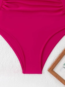Macro shot of rose pink swimsuit bottom showing fine stitching and quick-dry fabric texture