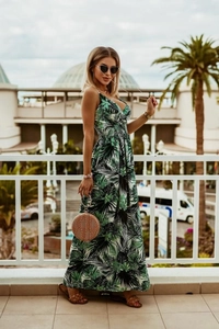 Detail of V-neck sleeveless maxi dress with tropical palm leaf print and high waist