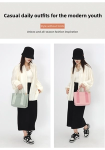 Detail of canvas tote lunch bags in mint green and pastel pink with front pockets