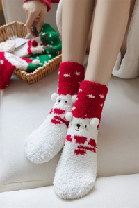 Detailed texture of thick coral fleece Christmas socks with cute polar bear animal toe design