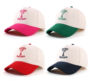 Detail of embroidered BIKINIS MARTINIS logo on vintage cotton baseball cap crowns