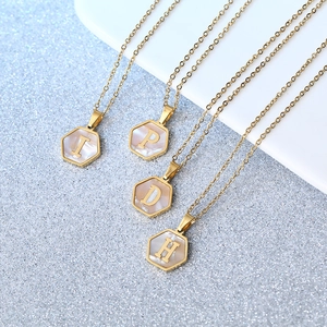 Gold hexagon initial necklaces with white shell inlay featuring letters I P D H