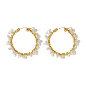 Elegant gold hoop earrings with white baroque pearls in a classic circular design