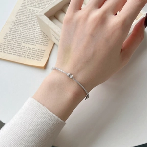 Macro detail of silver S925 sterling silver bracelet with rectangle cut diamond inlay