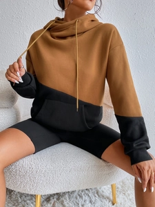 Brown and black color-block oversized hoodie with matching shorts on a model