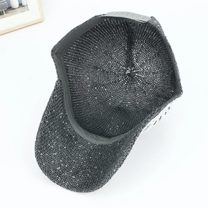 Detail of black sequin baseball cap showing breathable inner mesh and adjustable strap