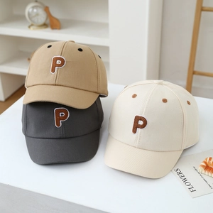Detailed view of kids cotton baseball caps in khaki, grey and white with P embroidery
