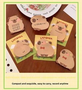 Macro detail of various Capybara shaped sticky notes with decorative yellow display cards