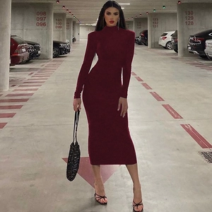 Detail of wine red bodycon dress featuring elegant high neck and sleek long sleeves