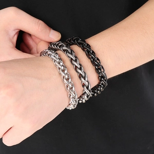 Three colors of men's woven stainless steel bracelets shown on wrist for styling