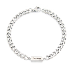 Detail showing polished stainless steel Cuban chain bracelet with Forever engraving