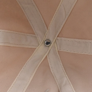 Detail showing the internal six-panel structure and reinforced tape of the cotton baseball cap