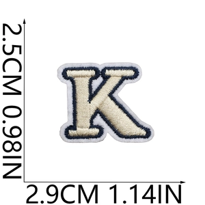 Detail showing letter K embroidered patch with size measurements 2.5cm by 2.9cm