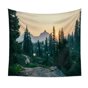Nature landscape wall tapestry featuring a dense forest and sunrise mountain scenery