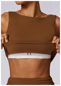 Detail showing the inner white elastic support band of the brown high-impact sports bra