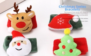 Close-up of four plush Christmas snap bracelets featuring reindeer, santa, and tree