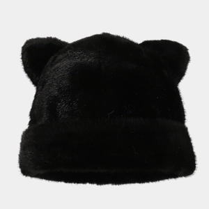 Detailed texture of black faux fur winter hat with cute cat ear design and soft plush fabric
