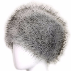 Detailed texture of thick grey faux fox fur on a flat top Russian style winter hat