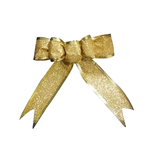 Sparkling gold glitter handmade Christmas bow ornament for holiday tree and festive decor