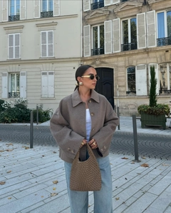 Chic autumn street style featuring a brown wool blend jacket with classic lapels and pockets