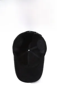 Detail view of winter baseball cap showing foldable ear flaps and warm inner lining
