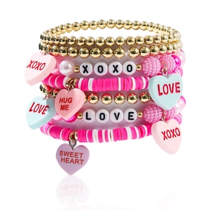 Handmade layered heart bracelet set in pink and white with LOVE and XOXO charms