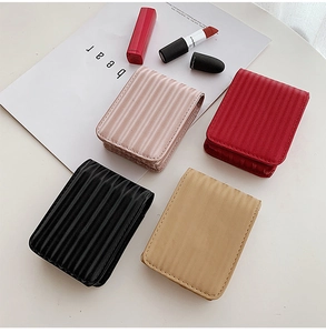 Textured leather mini makeup pouches in four colors with functional built-in mirrors