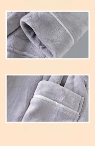 Detailed view of grey flannel bathrobe with white piping and durable reinforced stitching