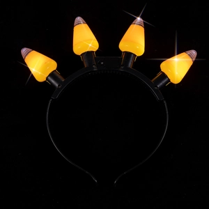 Detail of four yellow LED pumpkin glowing bulbs on a black Halloween knot headband
