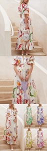 Detail view of floral print maxi dress with puff sleeves and button-up front design