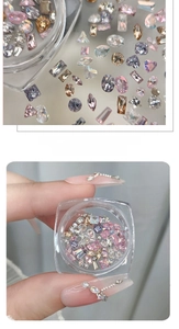 Macro shot of mixed mini zircon crystals in various shapes for nail art accessories