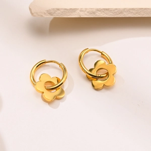 Golden titanium steel hoop earrings featuring elegant flower pendants on stone base
