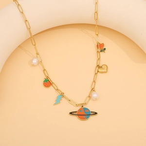 Close-up of golden clip necklace with colorful strawberry, lightning and planet charms