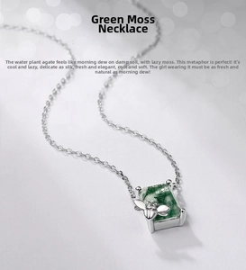 Detail of bee pendant with square green moss agate stone on silver necklace chain