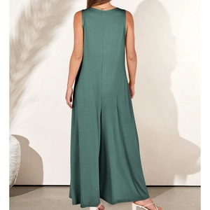 Rear view of dark green sleeveless wide-leg jumpsuit with minimalist drape and texture