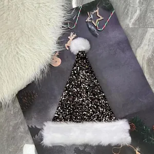 Christmas hat with gold and black sequins and plush trim on festive background
