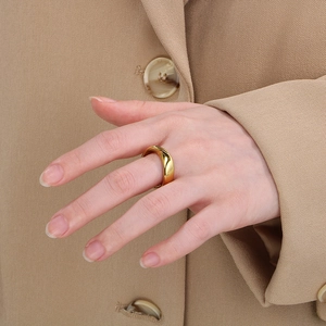 Minimalist irregular 18K gold plated stainless steel ring on model for women