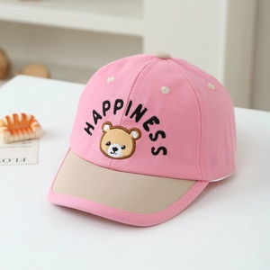 Detail of kids baseball cap with Happiness embroidery and cute brown bear patch