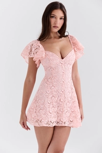 Detail of the elegant pink floral lace texture and deep V-neck design on the dress