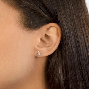 Detail view of S925 sterling silver tassel earring with pink zircon on ear lobe
