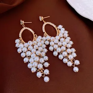 French vintage style earrings with cluster pearls and sparkling oval zircon accents