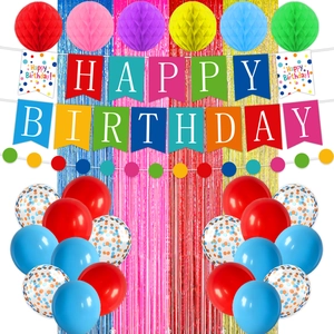 Detailed view of colorful Happy Birthday banners, party balloons, and paper honeycombs