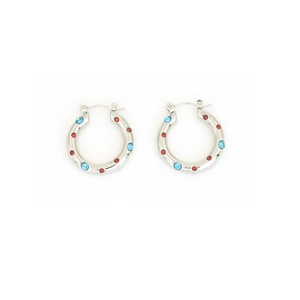 Detailed macro of silver hoop earrings inlaid with sparkling red and blue zircon stones