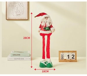 Detail view of 28cm plush Santa doll with telescopic legs and green sequin tree decor